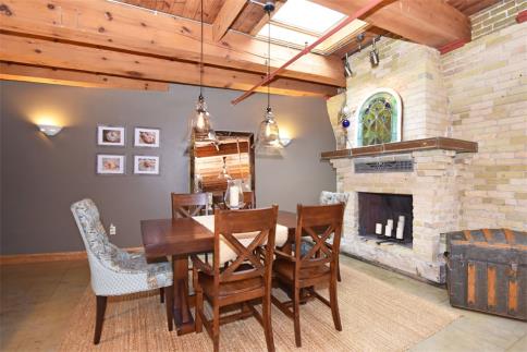 Dining  room with fireplace &amp; skylight